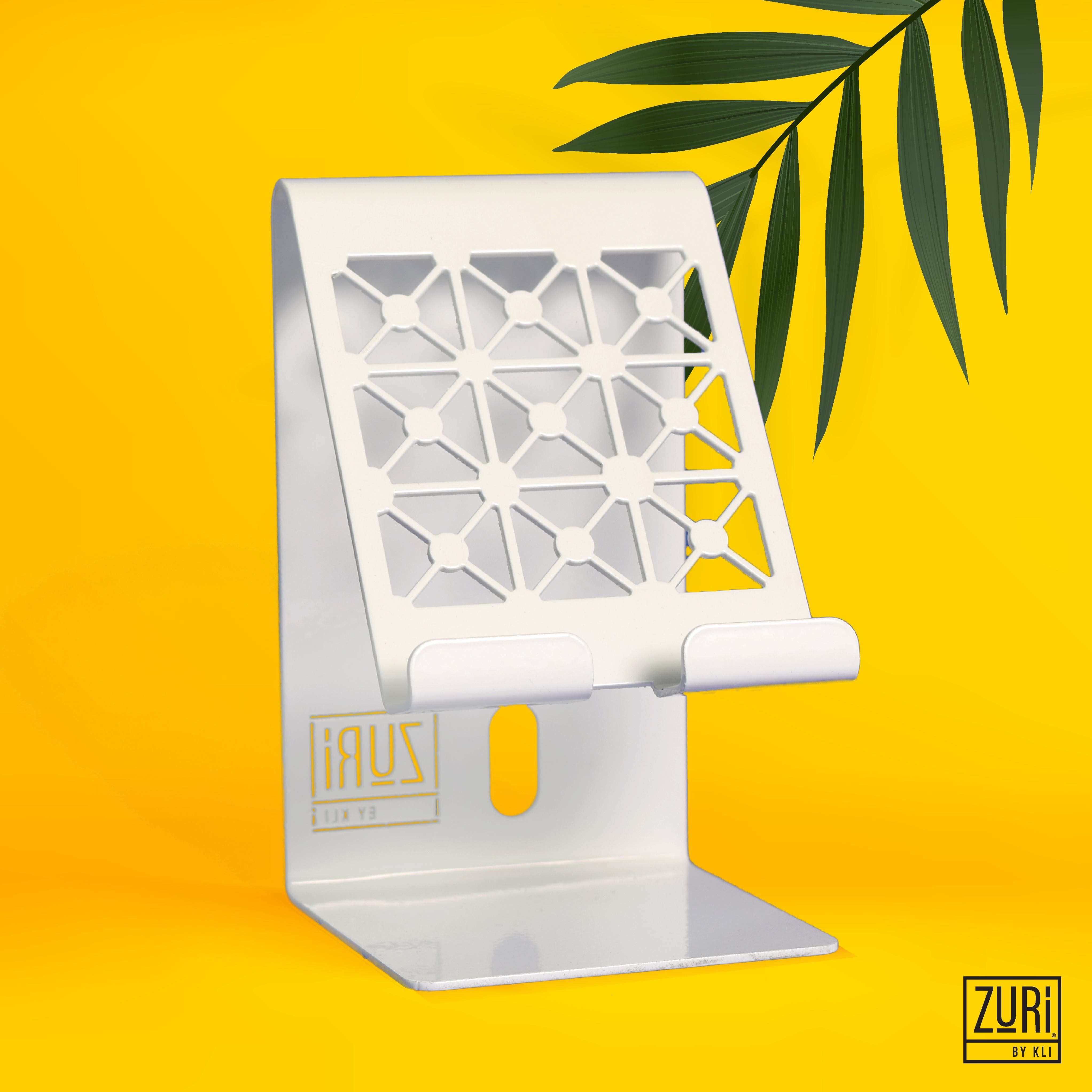 <p>Zuri Desk Mobile Phone Holder (Steel) </p>

<p>This  executive functional mobile phone holder is made of CRCA steel and electrostatically powder coated in either antique copper (Lady Design), antique silver (Geometric Design), arctic white (Geometric Design) or tangerine (Lady Design).</p>

<p>The front features two distinct design patterns and has a rear slot for running a USB charge cable, front slots for speakers and charging point for phones.</p>

<ul>
	<li>Dimensions ( L x W x H) : 8cm x 8cm x 13.5 cm</li>
	<li>Arctic White </li>
</ul>
