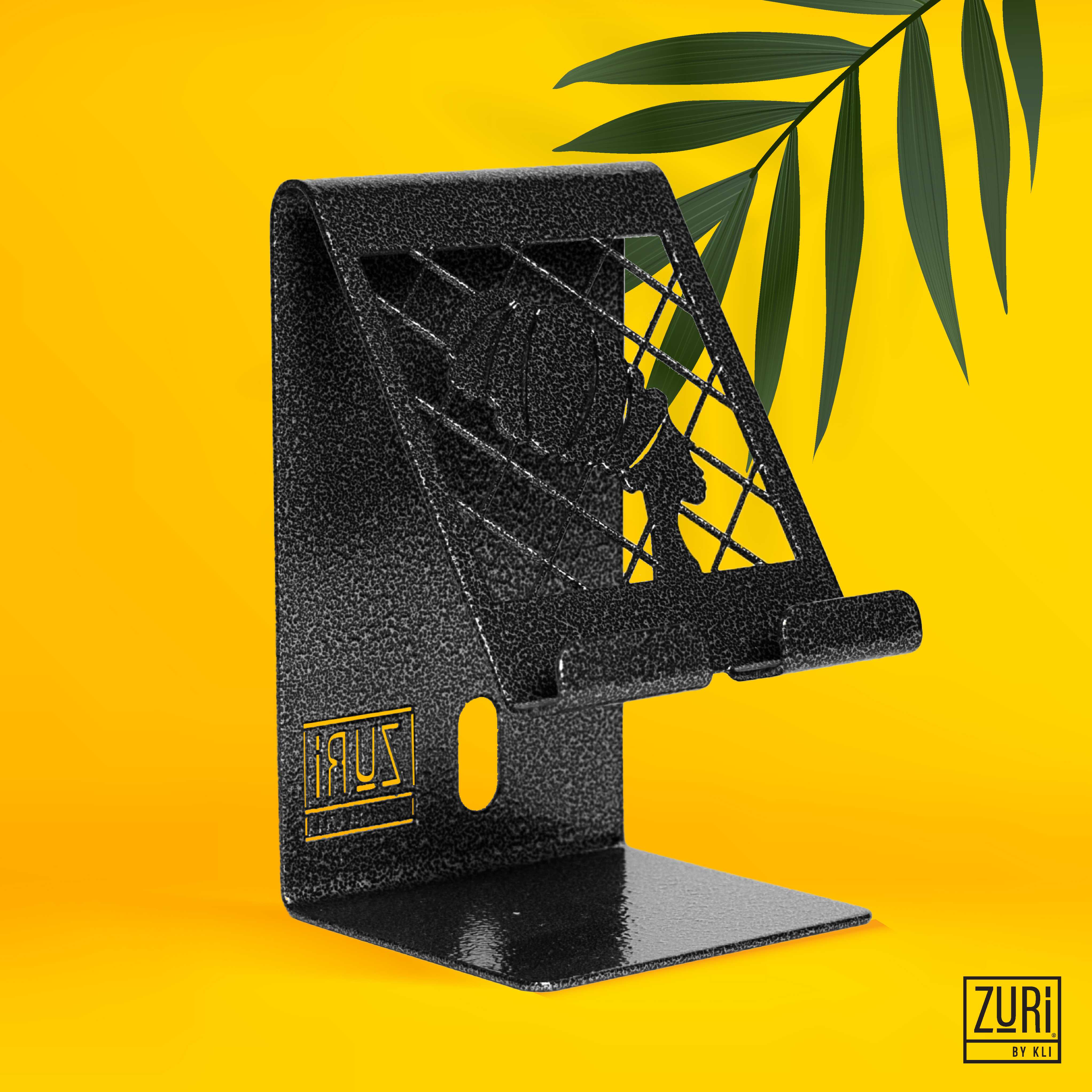 <p>Zuri Desk Mobile Phone Holder (Steel) </p>

<p>This  executive functional mobile phone holder is made of CRCA steel and electrostatically powder coated in either antique copper (Lady Design), antique silver (Geometric Design), arctic white (Geometric Design) or tangerine (Lady Design).</p>

<p>The front features two distinct design patterns and has a rear slot for running a USB charge cable, front slots for speakers and charging point for phones.</p>

<ul>
	<li>Dimensions ( L x W x H) : 8cm x 8cm x 13.5 cm</li>
	<li>Lady Design -Textured  Antique Silver</li>
</ul>
